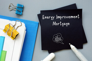 Business concept meaning Energy Improvement Mortgage with sign on the piece of paper.