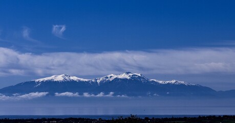 Scenic View Of Snowcapped Mountains Against Blue Sky