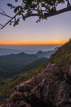 Mountains under mist in the Evening Setting sun beautiful Mountains from Doi Luang Chiang Dao Chiang Mai In Thailand Natural forest © pongsakorn