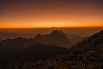 Mountains under mist in the Evening Setting sun beautiful Mountains from Doi Luang Chiang Dao Chiang Mai In Thailand Natural forest
