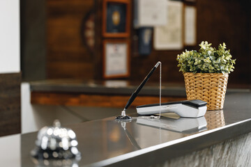 Hotel service bell on front desk counter