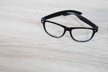 Glasses in black frames on a wooden table