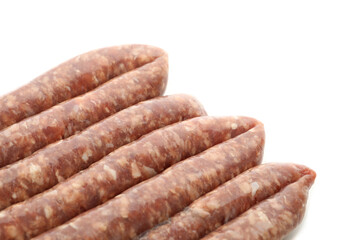 Tasty raw sausages isolated on white background