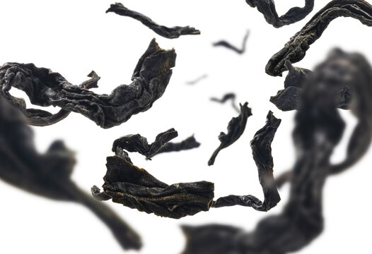 Dried Black Tea Close Up Levitating On White Background