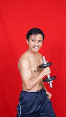 asian man holding barbell isolated red baclground