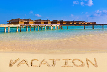 Word Vacation on beach