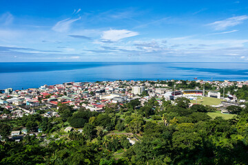 Naklejka na ściany i meble Scenic view of Roseau town and sea, Dominica island. Seen from the small mountain Morne Bruce