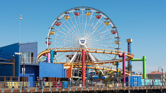 Santa Monica Pier, Los Angeles, California, USA - September 29, 2017: frontal view of the iconic ferris wheel from the famous Santa Monica Pier, between Venice beach and Santa Monica State Beach