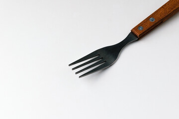 Iron fork on white background