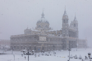 Cathedral of Almudena in madrid theater covered by snow from the storm philomena