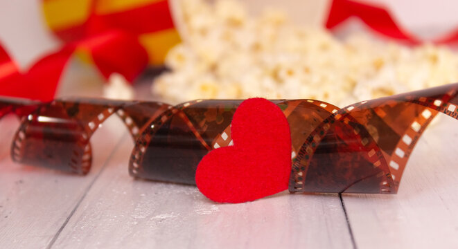 Red heart and film. The concept of cinema, love.
