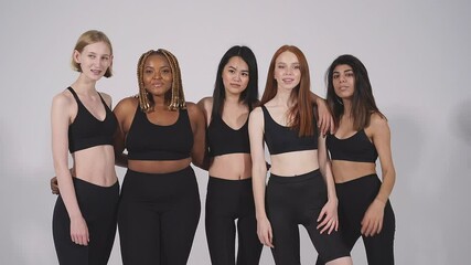 Joyful smiling diverse ladies posing at camera isolated in studio, natural beauty, tolerance concept.