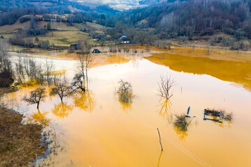 Flooded and abandoned village in the middle of a lake contaminated with cyanide at Geamana, near...