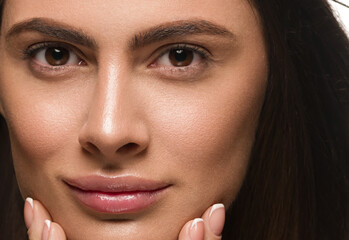 Beautiful woman face close up healthy natural skin