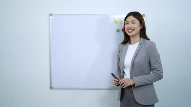 Learning online concept, Asian teacher teaching English online at home, self study and e-learning trends in times of corona virus and social distancing.