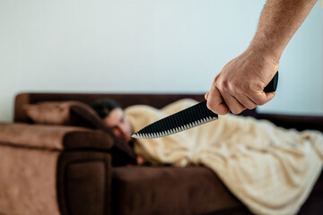 male With Knife Trying To Kill Man who sleeps. crime concept, at home