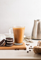 coffee with milk on wood board with sweet dessert