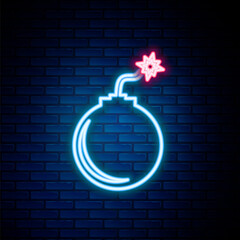 Glowing neon line Bomb ready to explode icon isolated on brick wall background. Colorful outline concept. Vector.