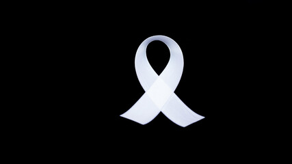 A white awareness ribbon on black background for peace condition