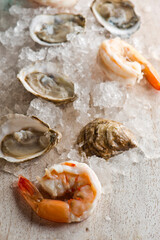 Oysters. Oysters on the half shell. Fresh oysters served with garlic, shallots, cocktail sauce, mignonette sauce and fresh lemons and limes. Classic American steakhouse or French bistro appetizer.