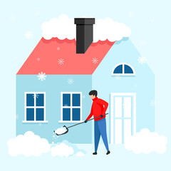  man with a shovel removes snow from the roof of the house. Clearing the area from snow during heavy snowfall.