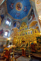 Fototapeta na wymiar Suzdal, Russia - December 28, 2020: Iconostasis and interiour of the Assumption Church