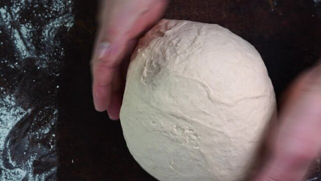 Italian Pizza Dough, chef hands kneads the dough DIY homemade dought concept. chef hands kneads the dough