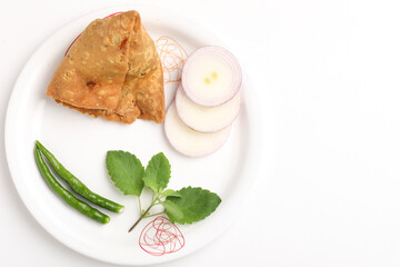 veg samosa served with green chilly chutney onion on white background
