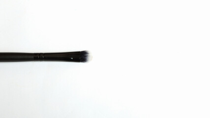 make-up brush close up on white backgorund.