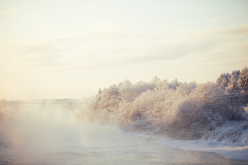 Winter landscape. Frost, white, mist, water, river, forest, tree, evaporation, fog