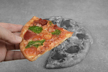 Pizza with salami on a kitchen table