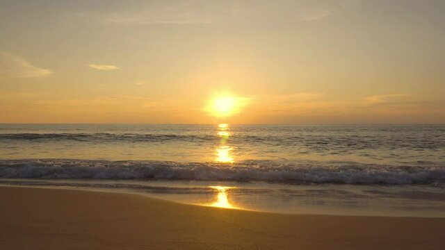 Sunset in sea. Landscape beach sea sun set over seawater. Golden sky background.