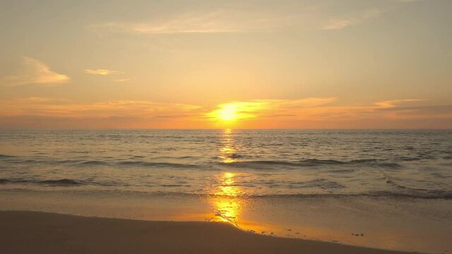 Sunset in sea. Landscape beach sea sun set over seawater. Golden sky background.