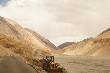 Construction work along the road in the sandy mountains of Himalayas