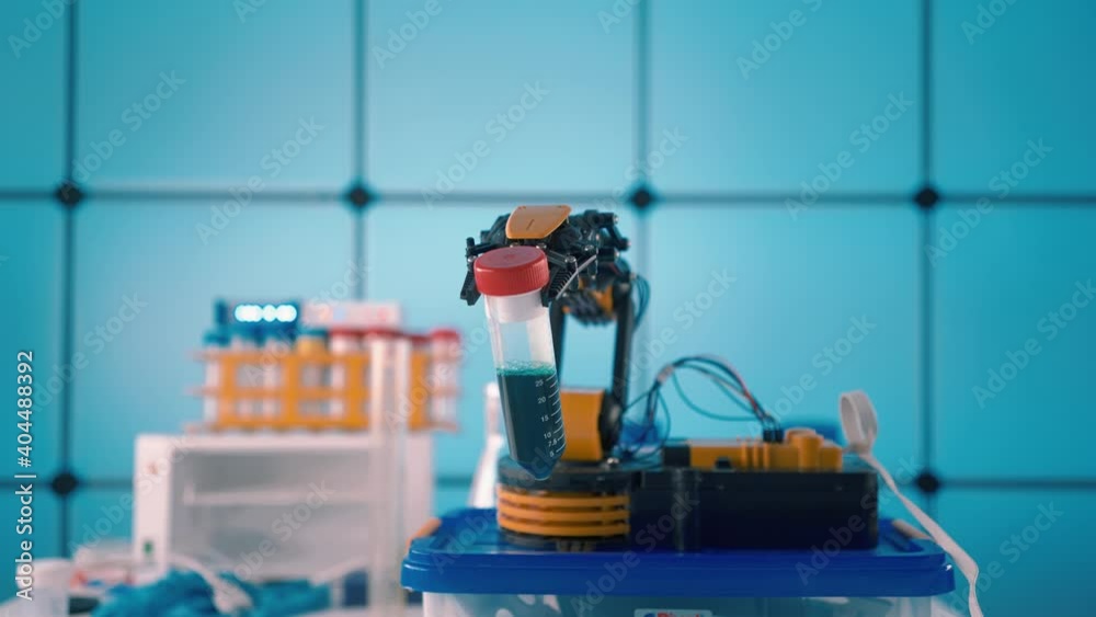 Poster Robot arm with test tube in laboratory