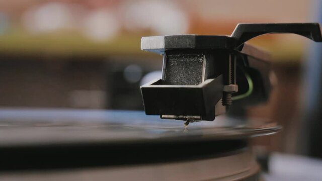 Vinyl record is spinning. Old retro turntable.Turntable stylus on a record.