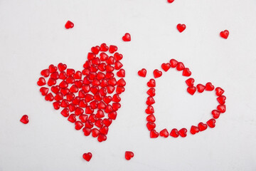 Red heart compositions on a white background.