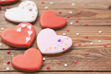 Obraz na płótnie Canvas Heart shaped cookies for Valentine's day or Mother's day on wooden background.