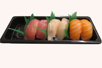 sushi variety variety of sushi in transport and sale container
