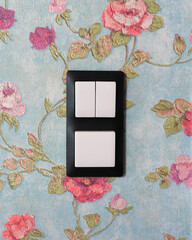 wall light switch keypad on a beautiful wall with flowers