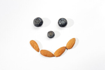 blackberry with nuts, healthy food on white isolated background 