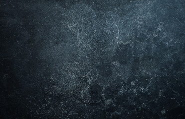 Grunge dark grey stone wall background.