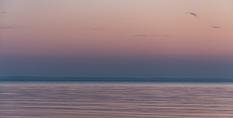Fototapeta na wymiar December sunrise with a beach and sea bay in the background