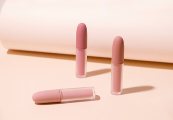 Matte lipstick on a beige background. Minimalism.