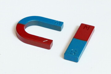 Close-up Of Magnet Over White Background