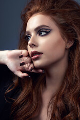 Fashion portrait of beautiful red hair woman