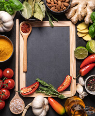 vegetables and spices,blackboard and wooden spoon