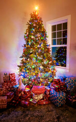 Beautiful Christmas tree surrounded by presents