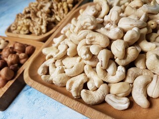 Mixture of nuts lying on a wooden plate