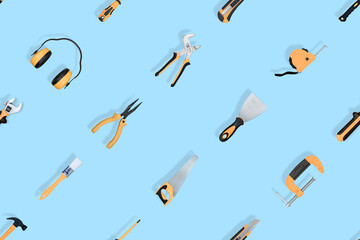 Tools seamless pattern. Various construction tools on a blue background.